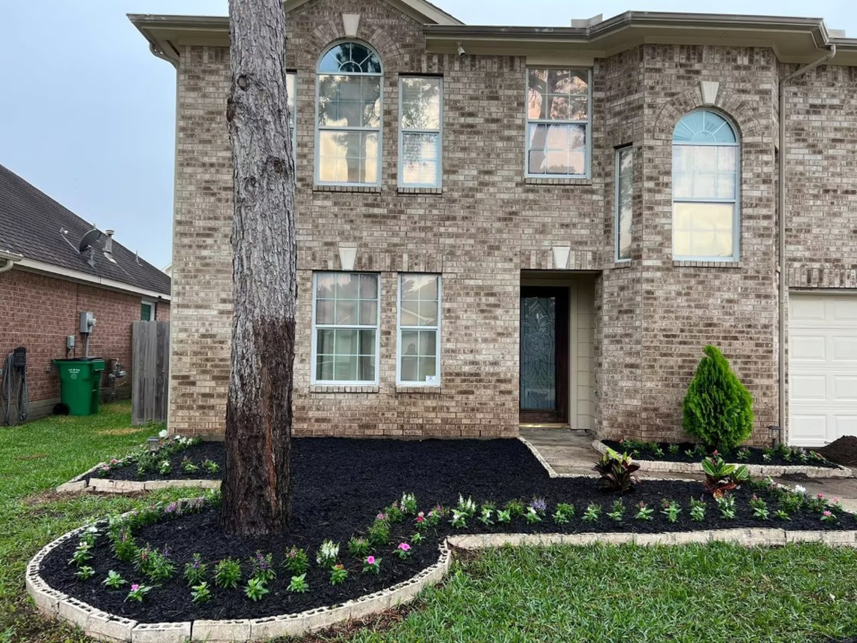 Front yard flower beds and mulch installation in Houston